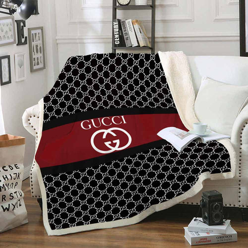 Red and black Gucci blanket
