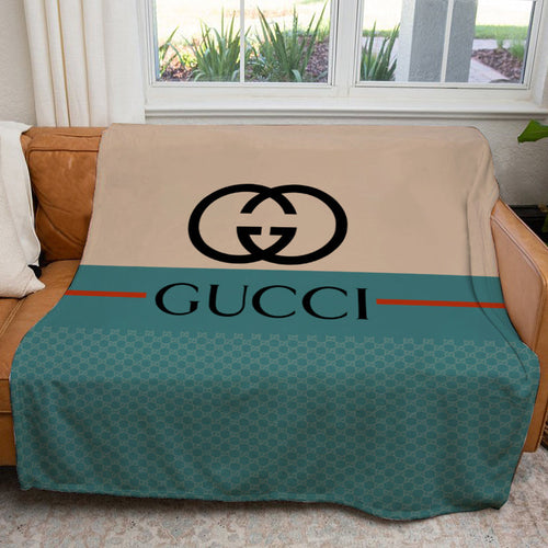 Beige and blue Gucci blanket