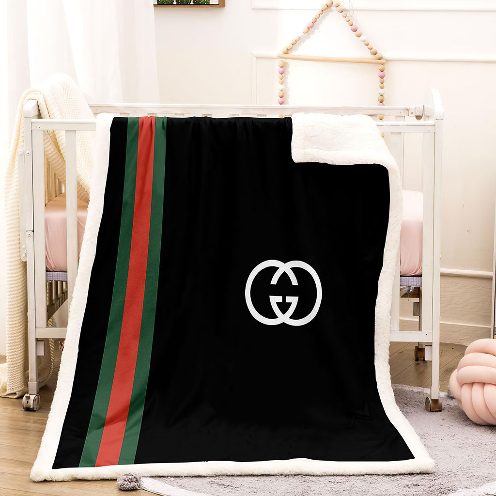 Green and black Gucci blanket